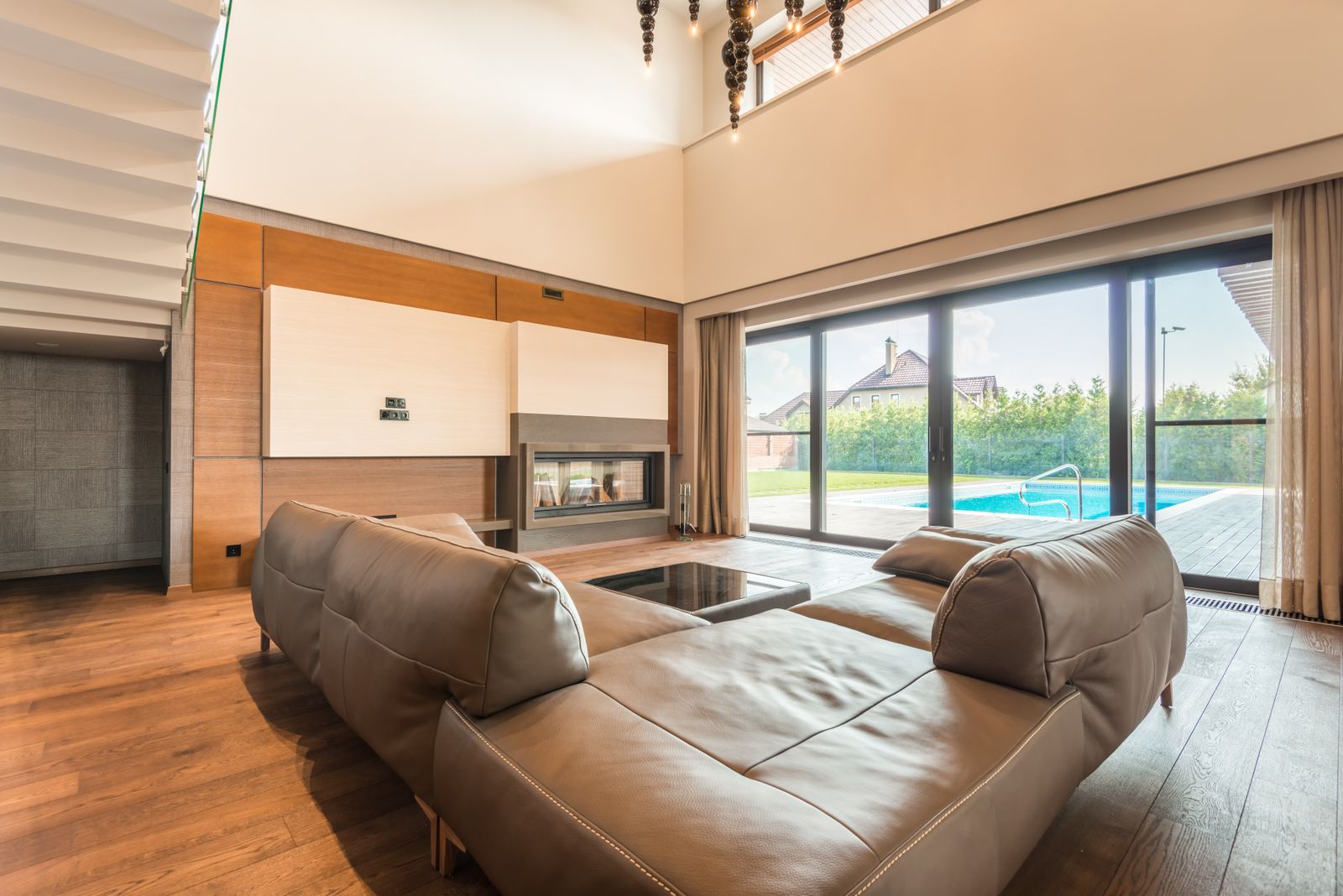 Four-panel slider opening a living room onto the deck