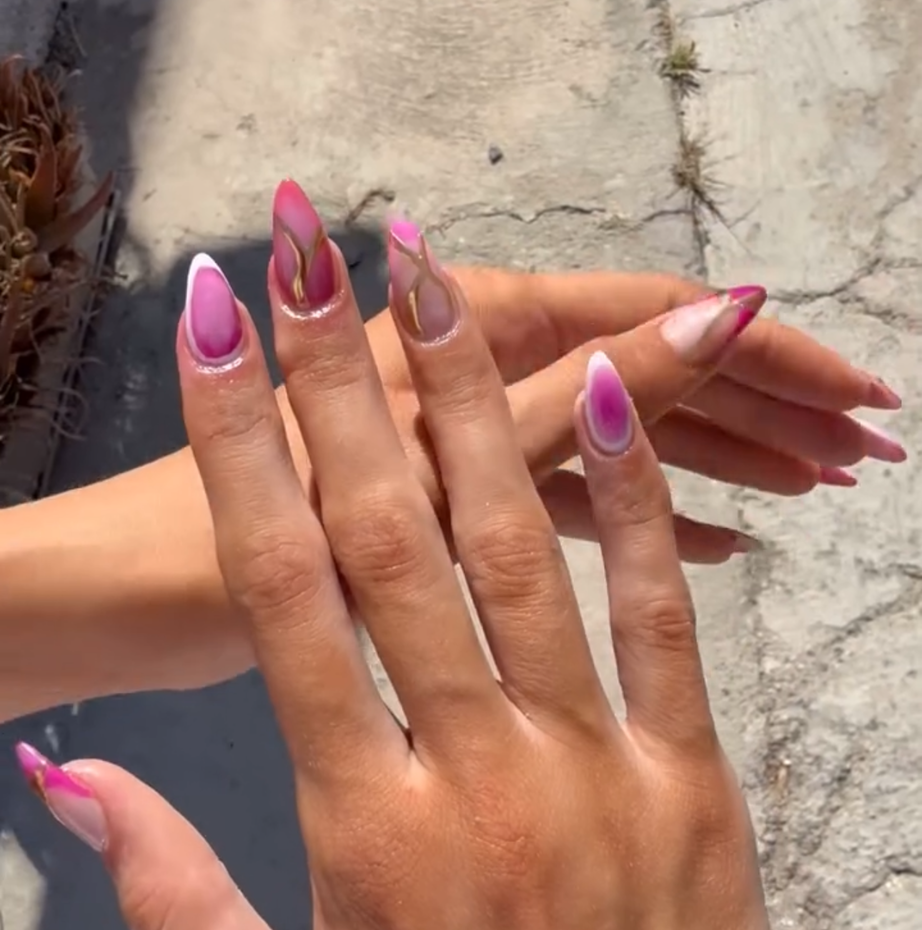 Pink ombre almond nails with gold accents
